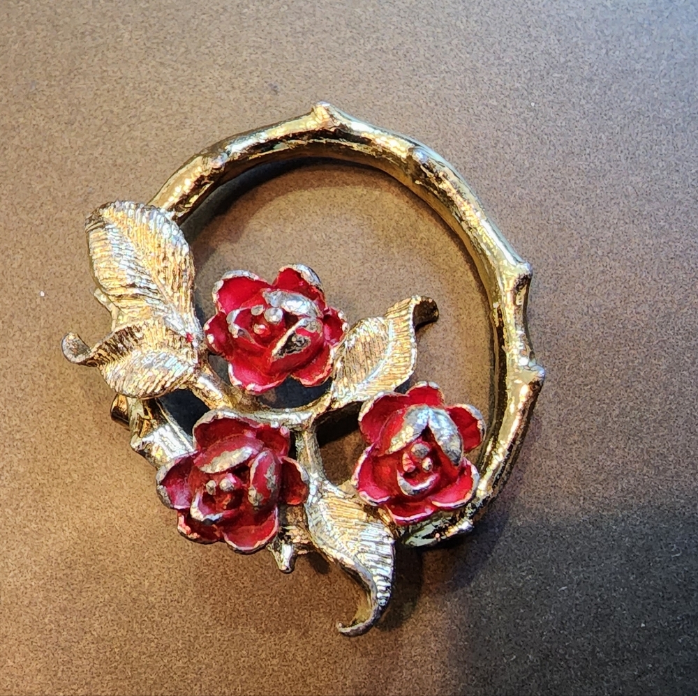Gerry's Goldtone brooch with red roses, some paint missing on the roses